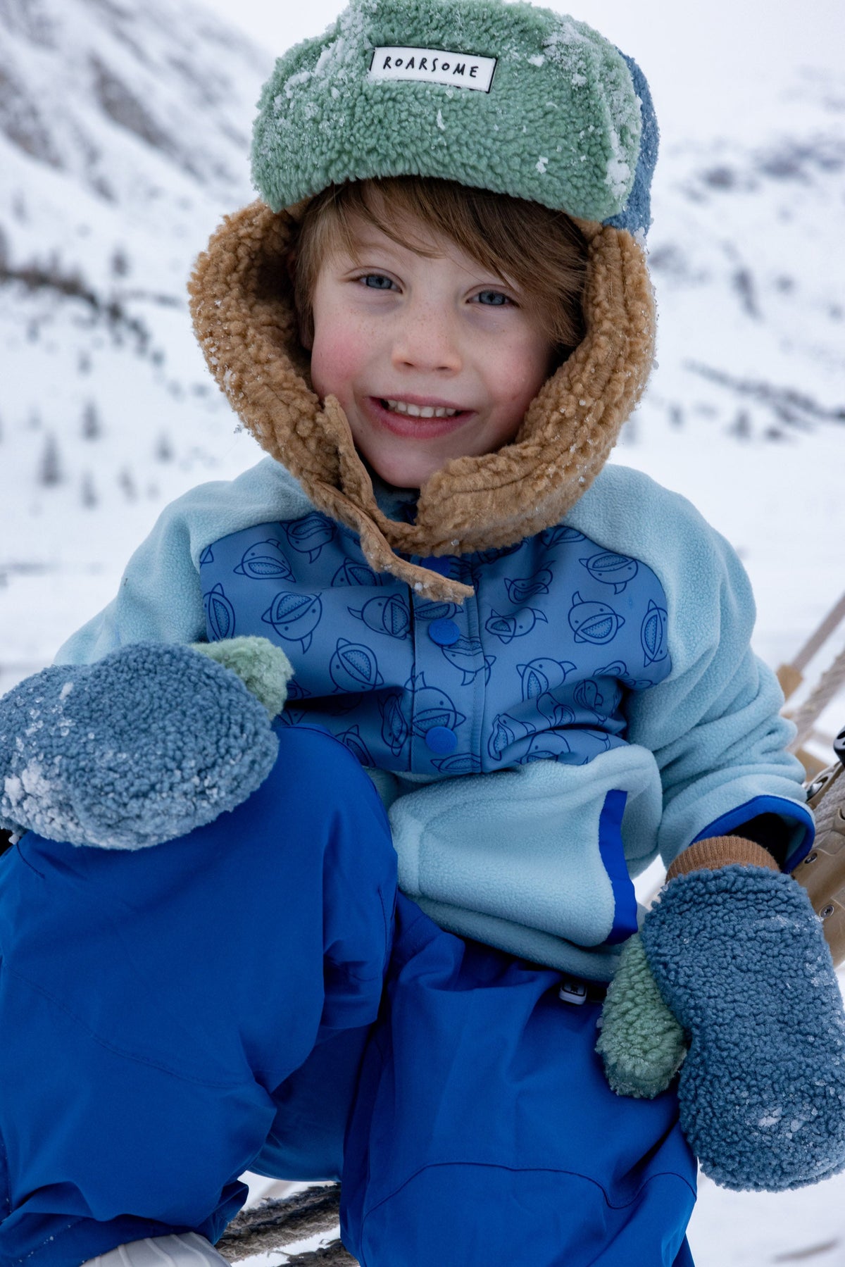 Roarsome - Kinder-Trapper-Mützen - Blau/Beige