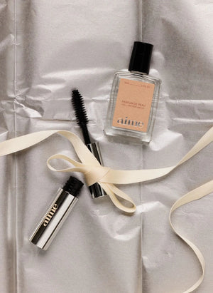 AIME - La Touche Finale Roll-On Perfume y Mini Máscara Set