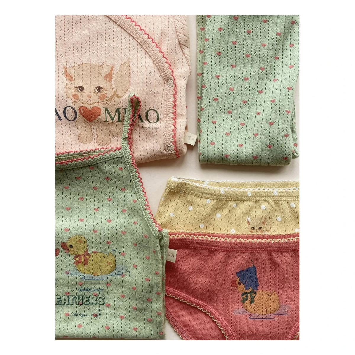 Konges Sløjd - Body de punto calado de algodón orgánico Minnie Ciao Miao | Rosa
