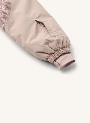 Wheat - Melte Fleurs Skioverall aus recycelten Fasern | Hellrosa